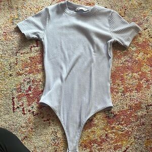 SO blue bodysuit